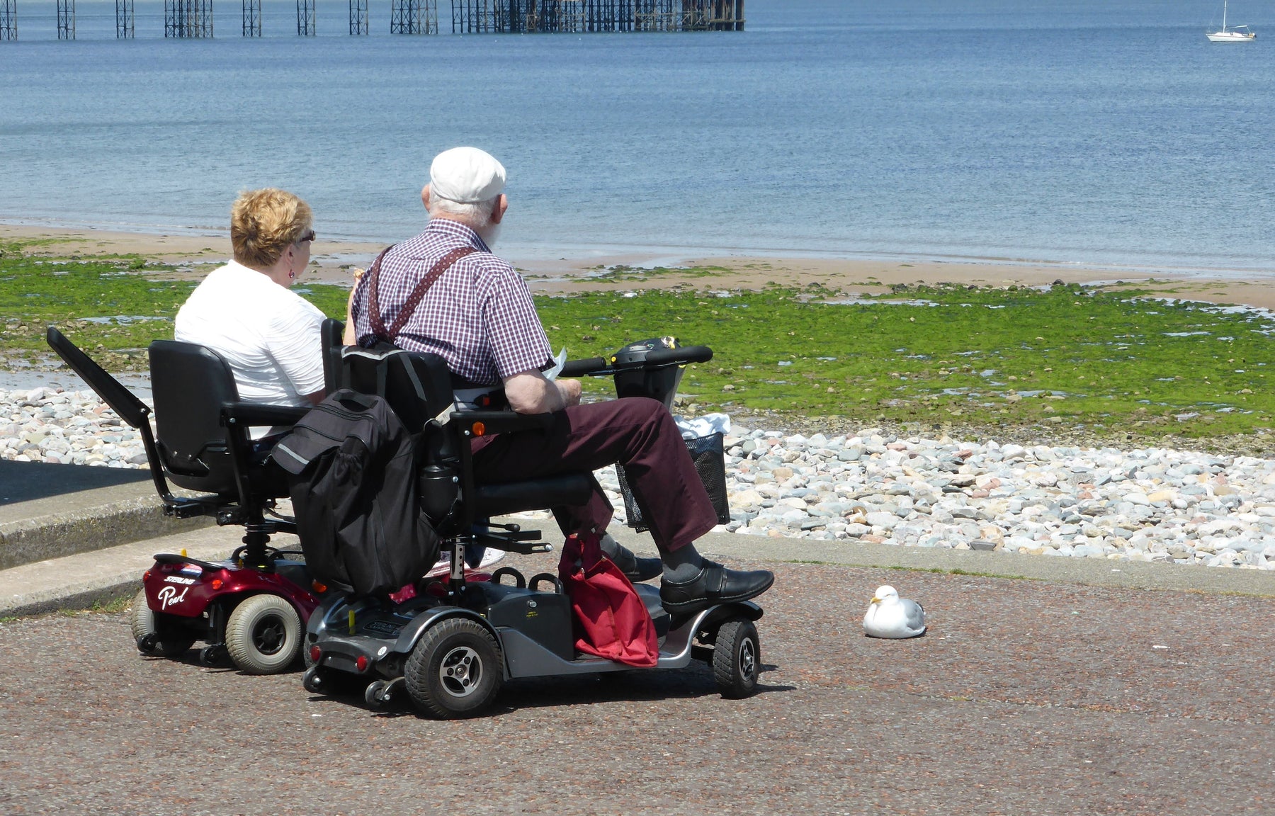 A traveller outdoors with a mobility scooter